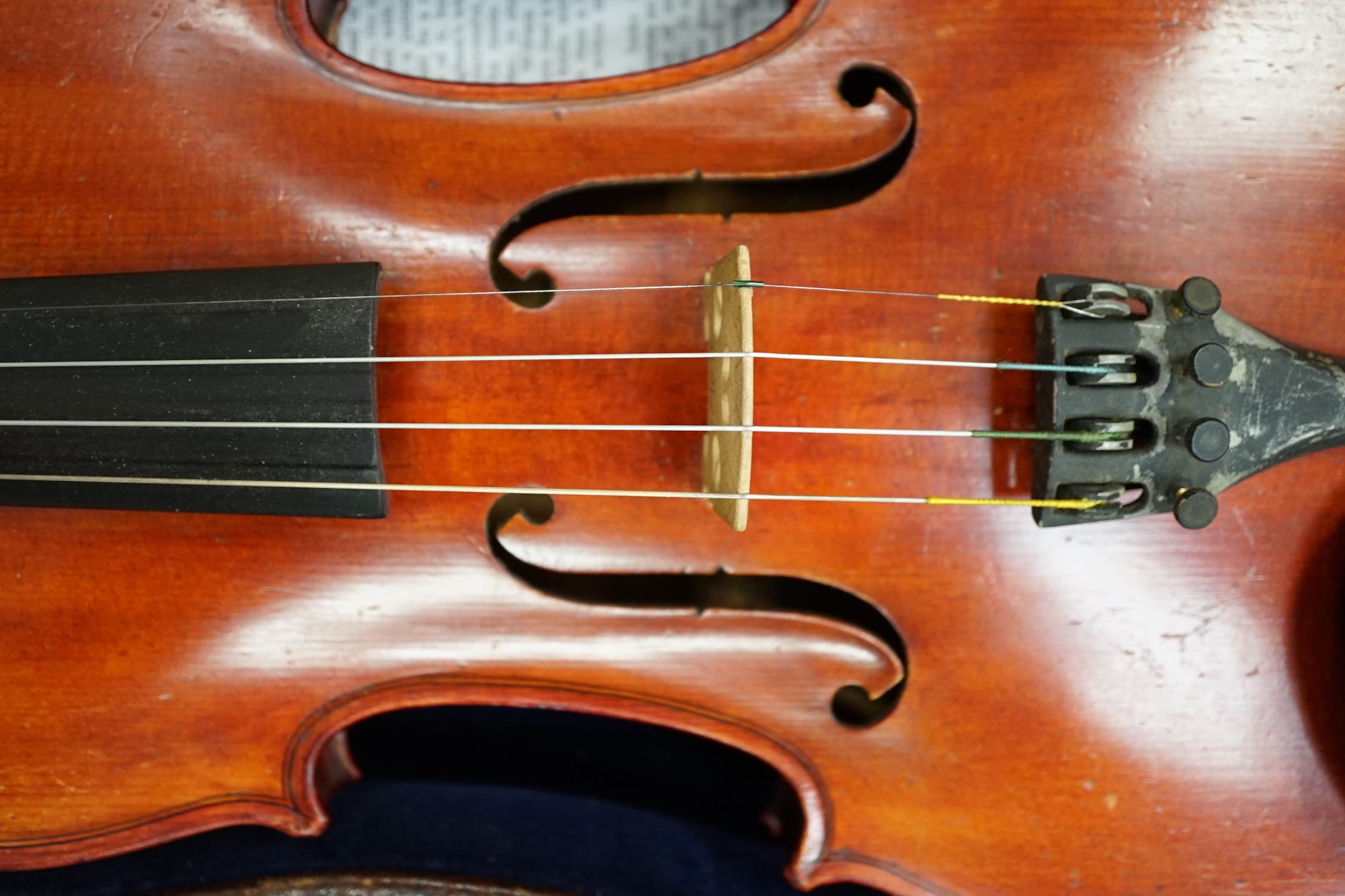 An English cased violin by Thomas J. Bellingham, Leeds, 1909, body length, 35.5cm, with a chased silver mounted bow CITES Submission reference WNR7TU27